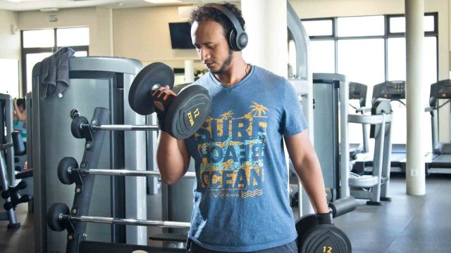 Student lifting dumbbells at Sparc Student lifting dumbbells at Sparc Sport Centre